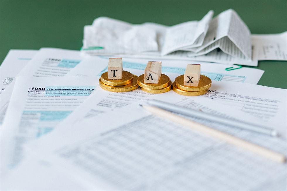 Form 1040 individual tax return paperwork with receipts